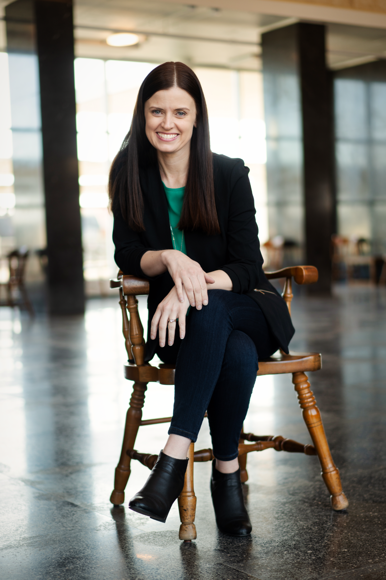 women sitting in chair business picture
